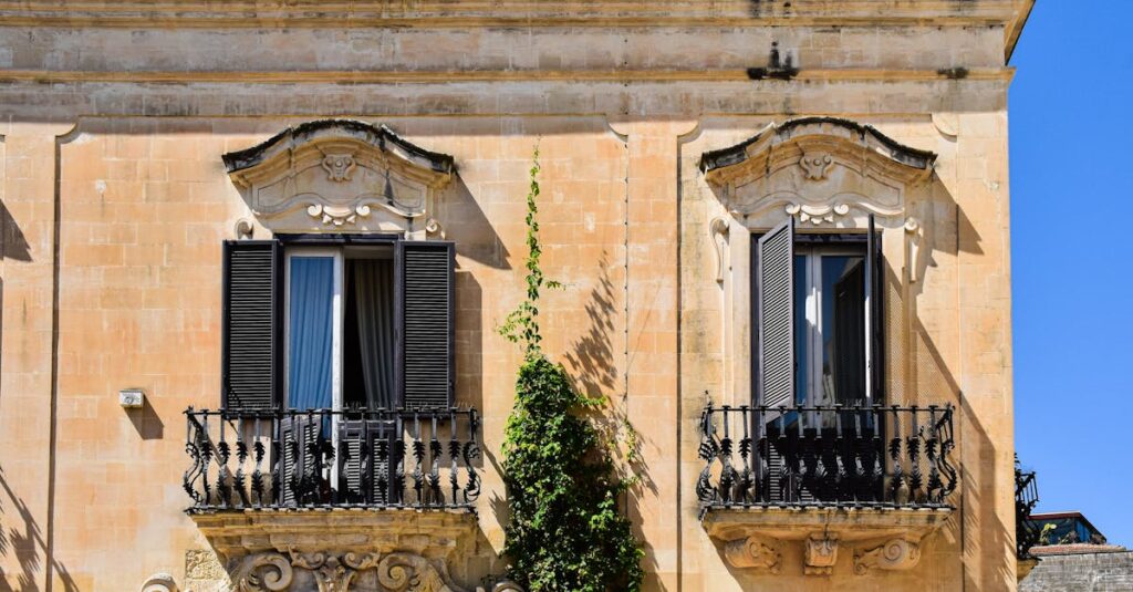 pexels-photo-29794338-29794338 Detailed Baroque architecture in Apulia with ornate balconies and ivy on a sunny day.